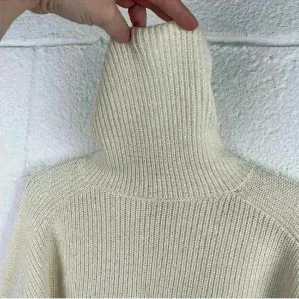 COS Roll neck sweater in white and black striped wool and cotton blend